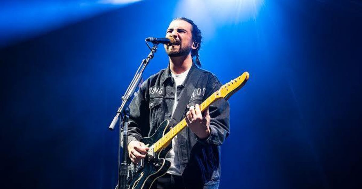 Noah Kahan performing live on tour